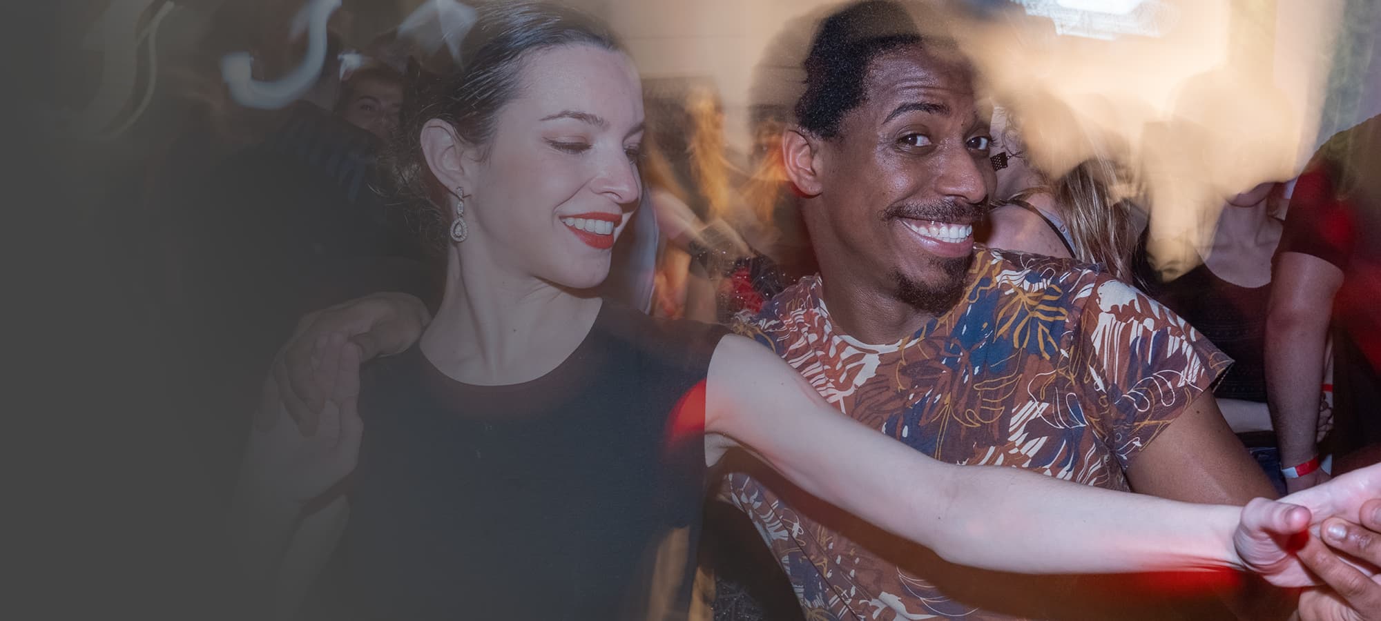 Couple dancing salsa at a party